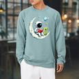 UFO Alien Astronaut Reading Book In Space Raglan Sleeve Sweatshirt Cardinal UFO Alien Astronaut Reading Book In Space Raglan Sleeve Sweatshirt Cardinal