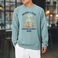 Unearth a Story Triceratops Dinosaur Reading Books Cute Dino Raglan Sleeve Sweatshirt Cardinal