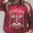 A Book A Day Keeps Reality Away Classic Fantasy Dragon Raglan Sleeve Sweatshirt Heather Dust