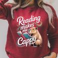 Book Lover Reading Makes Me Cappy Pun Capybara Reading Raglan Sleeve Sweatshirt Heather Dust