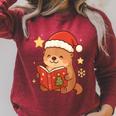 Cute Christmas Book Otter Reading Snowy Holiday Story Raglan Sleeve Sweatshirt Heather Dust Cute Christmas Book Otter Reading Snowy Holiday Story Raglan Sleeve Sweatshirt Heather Dust