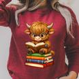 Cute Highland Cow With Glasses Reading Books Raglan Sleeve Sweatshirt Heather Dust