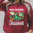 Easily Distracted By Coffee Books And Dragons Fantasy Sci-Fi Raglan Sleeve Sweatshirt Heather Dust