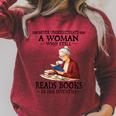 Never Underestimate A Woman Who Still Reads Books In Her Raglan Sleeve Sweatshirt Heather Dust