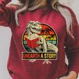 Unearth a Story Dinosaur Reading Book Dino T Rex Summer 2026 Raglan Sleeve Sweatshirt Heather Dust