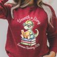 Unearth A Story Summer Reading 2026 Cute Dino Book Lover Raglan Sleeve Sweatshirt Heather Dust