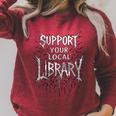 Women's Support Your Local Library Death Metal And Hardcore Book Raglan Sleeve Sweatshirt Heather Dust