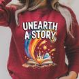 Women's Unearth A Story Rainbow Treasure Book Summer Reading 2026 Raglan Sleeve Sweatshirt Heather Dust Women's Unearth A Story Rainbow Treasure Book Summer Reading 2026 Raglan Sleeve Sweatshirt Heather Dust