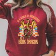 In A World Of Bookworms Be A Book Dragon Raglan Sleeve Sweatshirt Heather Dust In A World Of Bookworms Be A Book Dragon Raglan Sleeve Sweatshirt Heather Dust