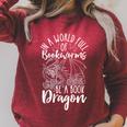 IN A WORLD FULL OF BOOKWORMS BE A Book Dragon Reader Raglan Sleeve Sweatshirt Heather Dust