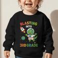 Blasting Into 3rd Grade Dinosaur Astronaut Back To School Graphic Toddler Sweatshirt Blasting Into 3rd Grade Dinosaur Astronaut Back To School Graphic Toddler Sweatshirt