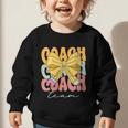 Coach Team Groovy Coquette Bow Cute Back To School Graphic Toddler Sweatshirt Coach Team Groovy Coquette Bow Cute Back To School Graphic Toddler Sweatshirt