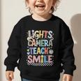 Lights Camera Teach Smile Back To School Awesome Learners Graphic Toddler Sweatshirt Lights Camera Teach Smile Back To School Awesome Learners Graphic Toddler Sweatshirt