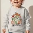 Groovy First Grade Wildflowers Back To School 1st Grade Graphic Toddler Sweatshirt Groovy First Grade Wildflowers Back To School 1st Grade Graphic Toddler Sweatshirt