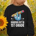 Back To School First Grade Sloth Hanging Out In 1st Grade Graphic Toddler Sweatshirt