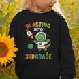 Blasting Into 3rd Grade Dinosaur Astronaut Back To School Graphic Toddler Sweatshirt Blasting Into 3rd Grade Dinosaur Astronaut Back To School Graphic Toddler Sweatshirt