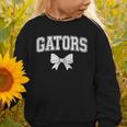 Gators High School Coquette Bow Gator Back To School Graphic Toddler Sweatshirt Gators High School Coquette Bow Gator Back To School Graphic Toddler Sweatshirt