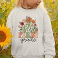 Groovy First Grade Wildflowers Back To School 1st Grade Graphic Toddler Sweatshirt Groovy First Grade Wildflowers Back To School 1st Grade Graphic Toddler Sweatshirt