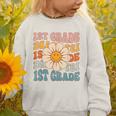 Retro 1st Grade Daisy Colorful Back To School First Grade Graphic Toddler Sweatshirt