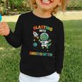 Blasting Into Kindergarten Dinosaur Astronaut Back To School Graphic Toddler Long Sleeve Tee Blasting Into Kindergarten Dinosaur Astronaut Back To School Graphic Toddler Long Sleeve Tee