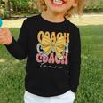 Coach Team Groovy Coquette Bow Cute Back To School Graphic Toddler Long Sleeve Tee Coach Team Groovy Coquette Bow Cute Back To School Graphic Toddler Long Sleeve Tee