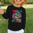 First Day Back To School 1st Grade Boys Football Dinosaur Graphic Toddler Long Sleeve Tee First Day Back To School 1st Grade Boys Football Dinosaur Graphic Toddler Long Sleeve Tee