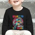 First Day Back To School 1st Grade Boys Football Dinosaur Graphic Toddler Long Sleeve Tee First Day Back To School 1st Grade Boys Football Dinosaur Graphic Toddler Long Sleeve Tee