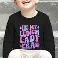 Groovy In My Lunch Lady Era Cafeteria Back To School Graphic Toddler Long Sleeve Tee Groovy In My Lunch Lady Era Cafeteria Back To School Graphic Toddler Long Sleeve Tee