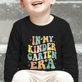 Kindergarten Era Happy Back To School Groovy Kids Boys Girls Graphic Toddler Long Sleeve Tee Kindergarten Era Happy Back To School Groovy Kids Boys Girls Graphic Toddler Long Sleeve Tee