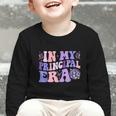 In My Principal Era Groovy School Principal Back To School Graphic Toddler Long Sleeve Tee In My Principal Era Groovy School Principal Back To School Graphic Toddler Long Sleeve Tee