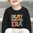 In My Principal Era Retro Groovy Back To School Principal Graphic Toddler Long Sleeve Tee In My Principal Era Retro Groovy Back To School Principal Graphic Toddler Long Sleeve Tee