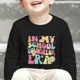 In My School Counselor Era Retro Back To School Counseling Graphic Toddler Long Sleeve Tee In My School Counselor Era Retro Back To School Counseling Graphic Toddler Long Sleeve Tee