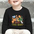 Wild About First Grade Safari Jungle Animals Back To School Graphic Toddler Long Sleeve Tee Wild About First Grade Safari Jungle Animals Back To School Graphic Toddler Long Sleeve Tee