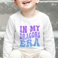 In My Dragons Era Back To School Spirit Game Retro Groovy Graphic Toddler Long Sleeve Tee In My Dragons Era Back To School Spirit Game Retro Groovy Graphic Toddler Long Sleeve Tee
