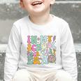 Groovy In My School Secretary Era Back To School Graphic Toddler Long Sleeve Tee Groovy In My School Secretary Era Back To School Graphic Toddler Long Sleeve Tee