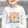 Retro 1st Grade Daisy Colorful Back To School First Grade Graphic Toddler Long Sleeve Tee Retro 1st Grade Daisy Colorful Back To School First Grade Graphic Toddler Long Sleeve Tee