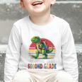 Roaring Into Second Grade T-Rex Back To School 2nd Grade Premium Tri-Blend Graphic Toddler Long Sleeve Tee Roaring Into Second Grade T-Rex Back To School 2nd Grade Premium Tri-Blend Graphic Toddler Long Sleeve Tee