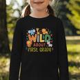 Wild About First Grade Safari Jungle Animals Back To School Graphic Toddler Long Sleeve Tee Wild About First Grade Safari Jungle Animals Back To School Graphic Toddler Long Sleeve Tee