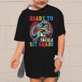 First Day Back To School 1st Grade Boys Football Dinosaur Graphic Kid T-Shirt First Day Back To School 1st Grade Boys Football Dinosaur Graphic Kid T-Shirt
