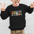 Back To School Student Safety Patrol Groovy Retro Graphic Kid Sweatshirt Back To School Student Safety Patrol Groovy Retro Graphic Kid Sweatshirt