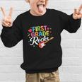 First Grade Rocks Colorful Back To School Guitar Graphic Kid Sweatshirt First Grade Rocks Colorful Back To School Guitar Graphic Kid Sweatshirt