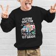 Kids Future Doctor 1st Grade Student Back To School Boy Kids Graphic Kid Sweatshirt Kids Future Doctor 1st Grade Student Back To School Boy Kids Graphic Kid Sweatshirt