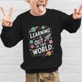 Learning Is Out Of This World Back To School Graphic Kid Sweatshirt Learning Is Out Of This World Back To School Graphic Kid Sweatshirt