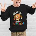 Roaring Into First Grade Lion 1st Grade Back To School Graphic Kid Sweatshirt Roaring Into First Grade Lion 1st Grade Back To School Graphic Kid Sweatshirt
