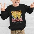School Nurse Groovy Coquette Bow Cute Back To School Graphic Kid Sweatshirt School Nurse Groovy Coquette Bow Cute Back To School Graphic Kid Sweatshirt