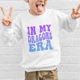 In My Dragons Era Back To School Spirit Game Retro Groovy Graphic Kid Sweatshirt In My Dragons Era Back To School Spirit Game Retro Groovy Graphic Kid Sweatshirt