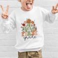 Groovy First Grade Wildflowers Back To School 1st Grade Graphic Kid Sweatshirt Groovy First Grade Wildflowers Back To School 1st Grade Graphic Kid Sweatshirt
