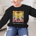 Dyslexia Interventionist Groovy Coquette Bow Back To School Graphic Kid Sweatshirt