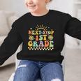 Next Stop 1st Grade Groovy Retro First Grade Back To School Graphic Kid Sweatshirt