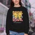 School Nurse Groovy Coquette Bow Cute Back To School Youth Crewneck Sweatshirt School Nurse Groovy Coquette Bow Cute Back To School Youth Crewneck Sweatshirt